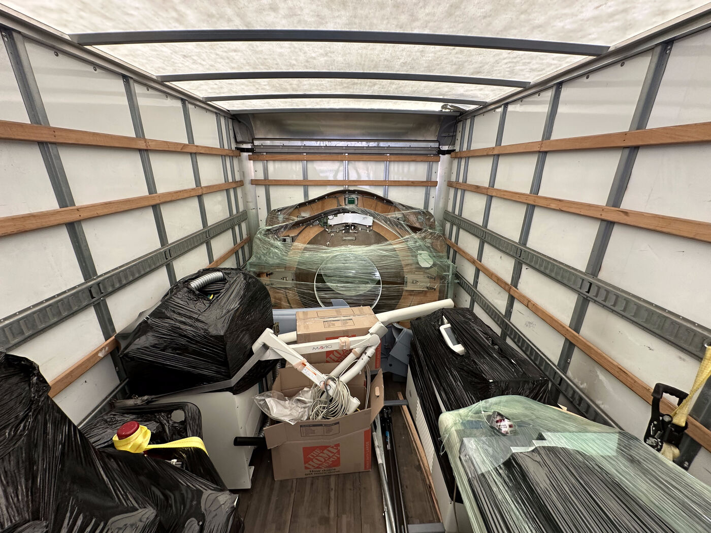 CT covers and components padded and secured inside a box truck