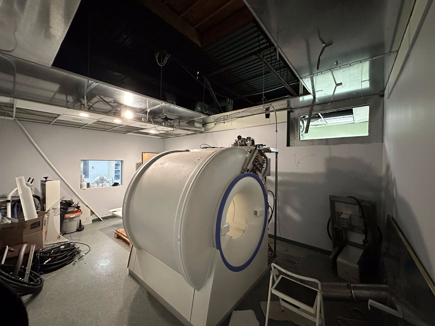 MRI magnet with ceiling opened for cold head and vent access during service work