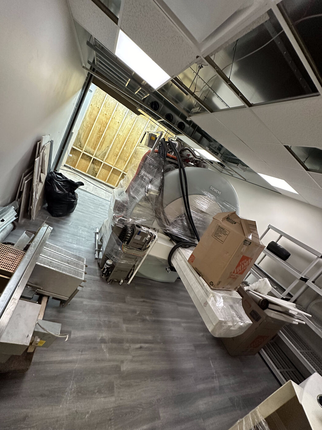 Siemens MRI system wrapped and staged for de-installation and transport