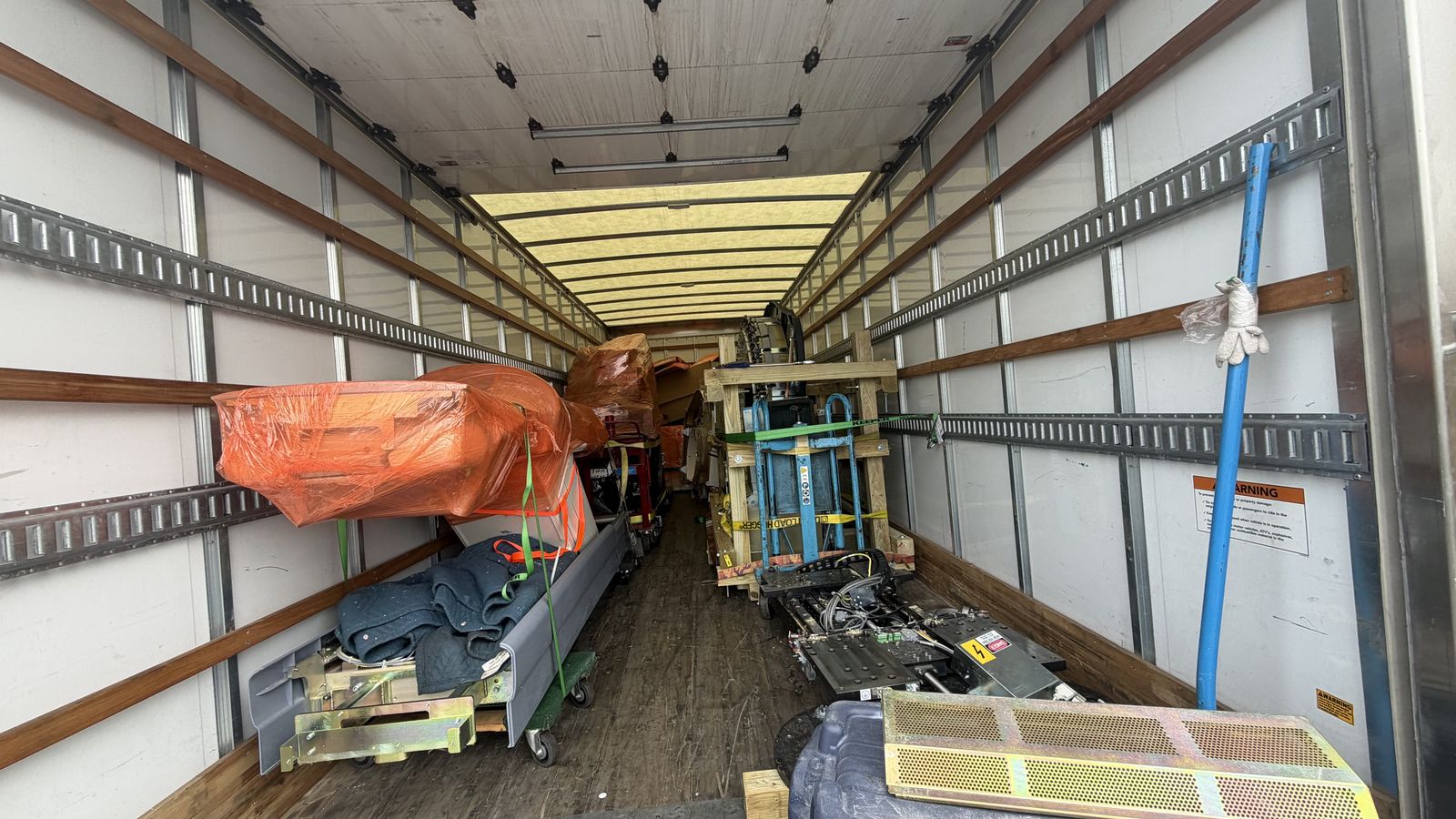 Box truck fully loaded with strapped and padded PET/CT components
